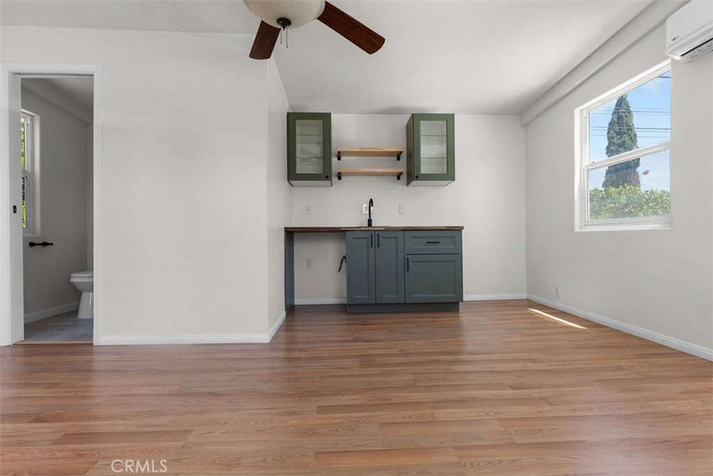 3569 Bandini Avenue Riverside, CA 92506 - Photo 35 of 51 a view of kitchen with wooden floor electronic appliances and window
