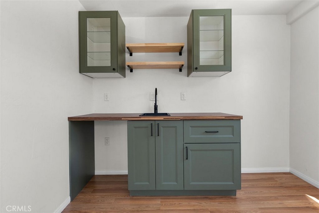 3569 Bandini Avenue Riverside, CA 92506 - Photo 36 of 51 a kitchen with a sink and a mirror
