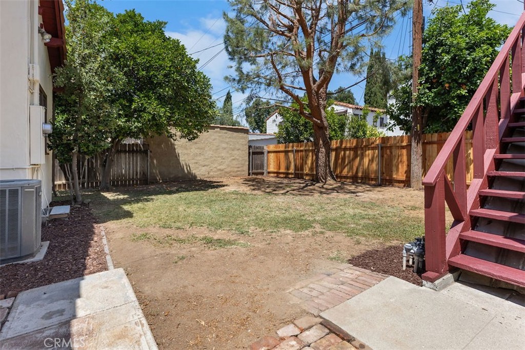 3569 Bandini Avenue Riverside, CA 92506 - Photo 42 of 51 a view of backyard with wooden fence and trees