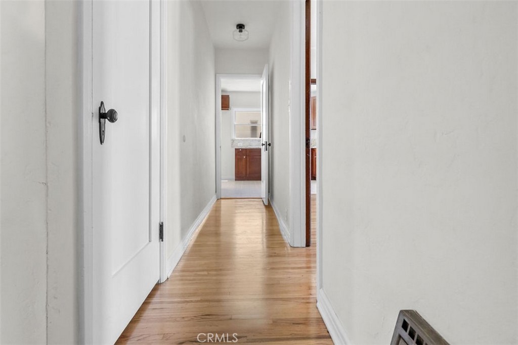 3569 Bandini Avenue Riverside, CA 92506 - Photo 47 of 51 a view of a hallway with wooden floor