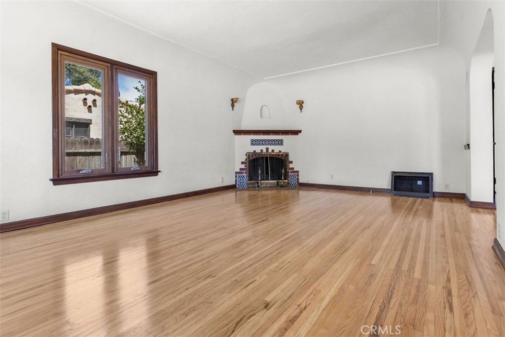 3569 Bandini Avenue Riverside, CA 92506 - Photo 6 of 51 a view of empty room with wooden floor and fan
