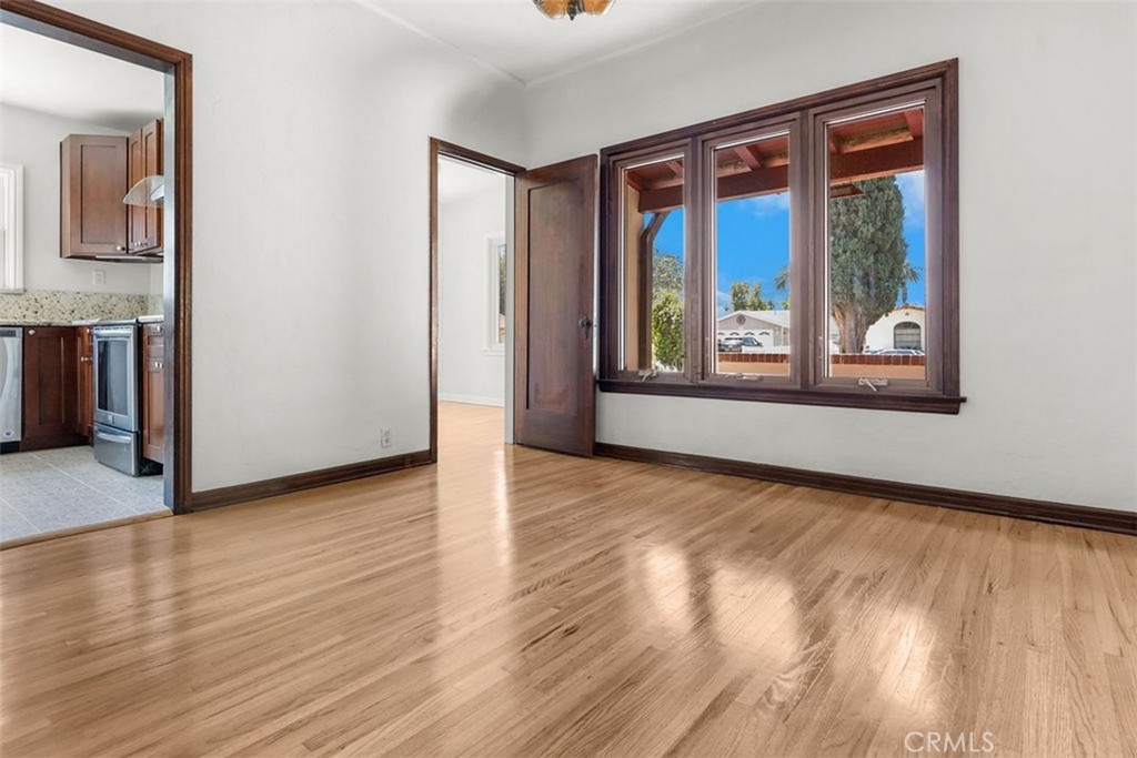 3569 Bandini Avenue Riverside, CA 92506 - Photo 10 of 51 a view of an empty room with wooden floor and a window