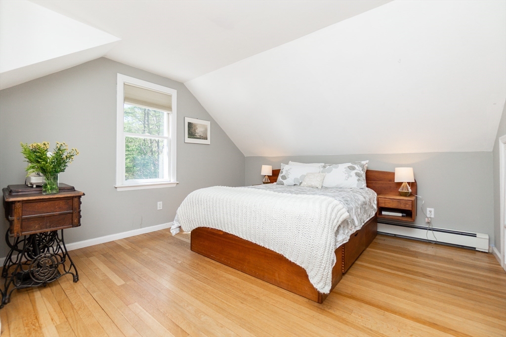 133 Glezen Lane Wayland, MA 01778 - Photo 18 of 30 a bedroom with a bed and a window