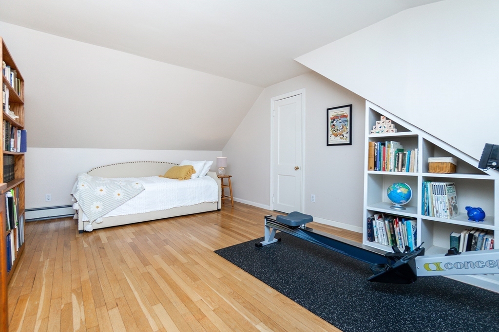 133 Glezen Lane Wayland, MA 01778 - Photo 20 of 30 a living room with furniture and a book shelf