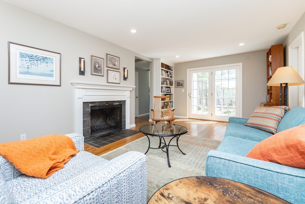 133 Glezen Lane Wayland, MA 01778 - Photo 5 of 30 a living room with furniture and a fireplace