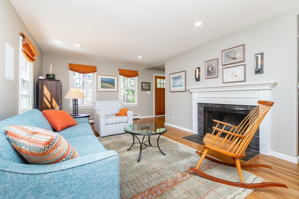 133 Glezen Lane Wayland, MA 01778 - Photo 6 of 30 a living room with furniture and a fireplace