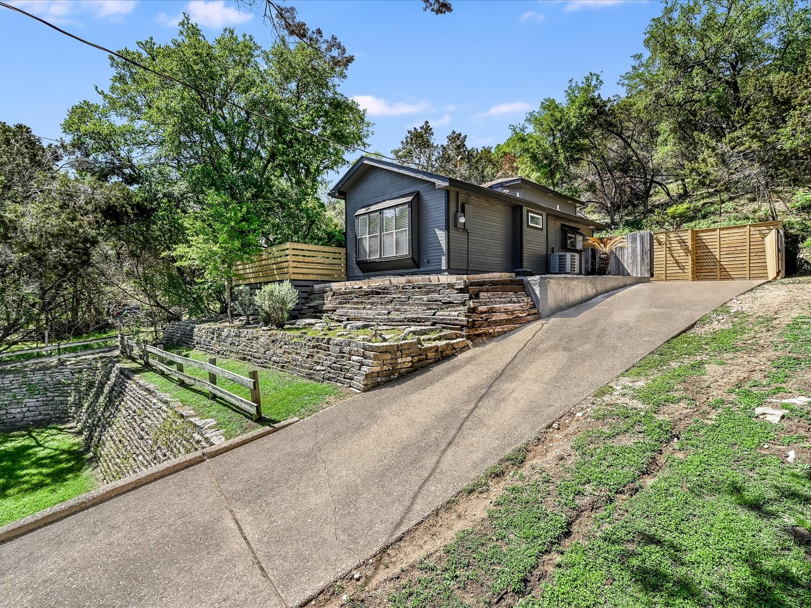 2712 Geronimo Trail Austin, TX 78734 - Photo 2 of 31 a view of a house with tree s