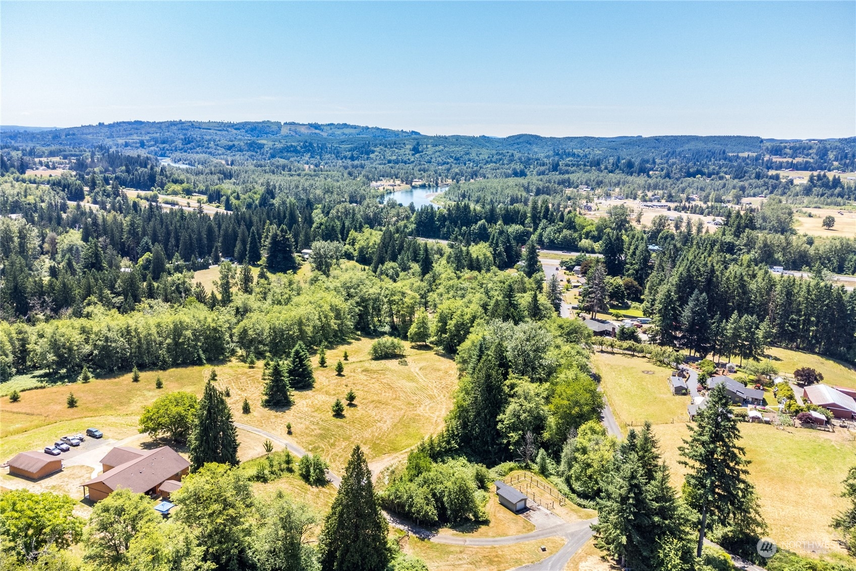 227 Hardy Road Kelso, WA 98626 - Photo 15 of 16 a view of a lake with mountains in the background