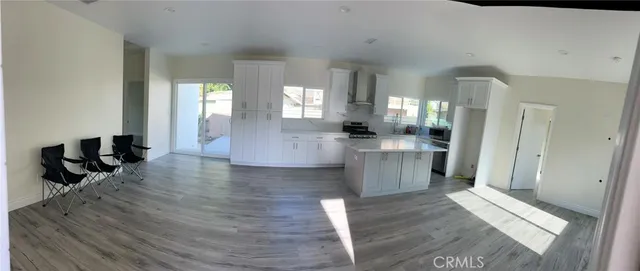 a large hall with lots of counter space and windows