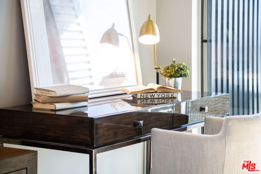 12431 Rochester Avenue, Unit 102 Los Angeles, CA 90025 - Photo 11 of 28 a living room with furniture and a potted plant