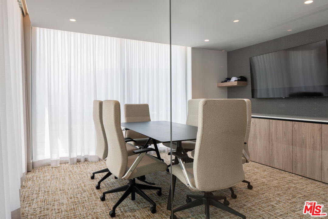 12431 Rochester Avenue, Unit 102 Los Angeles, CA 90025 - Photo 27 of 28 a view of a dining room with furniture and a window