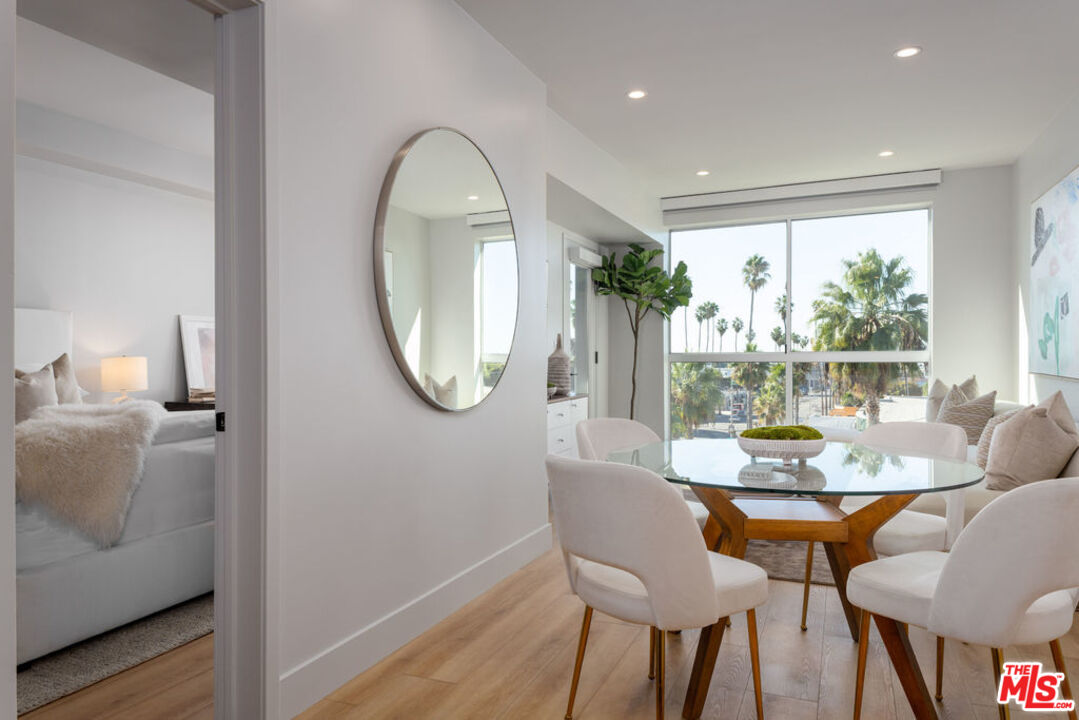 12431 Rochester Avenue, Unit 102 Los Angeles, CA 90025 - Photo 3 of 28 a view of a dining room with furniture window and wooden floor