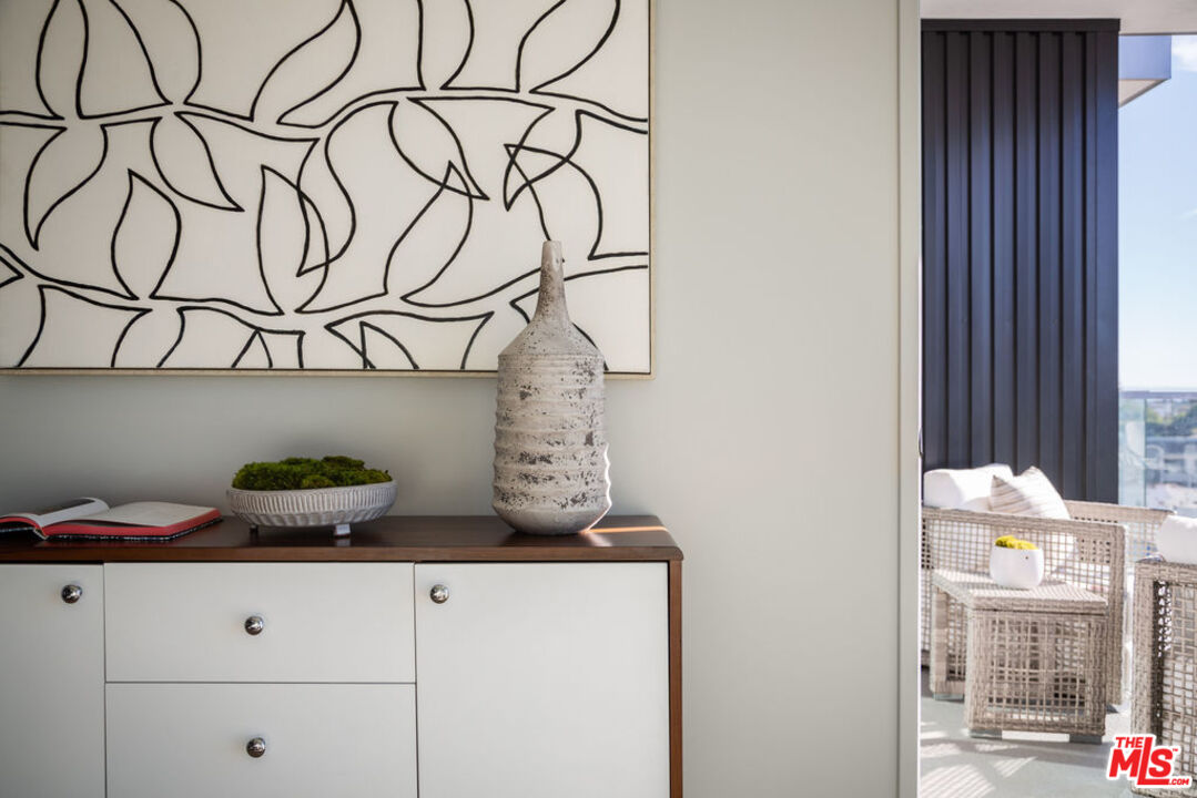 12431 Rochester Avenue, Unit 102 Los Angeles, CA 90025 - Photo 5 of 28 a close view of white cabinets and sink