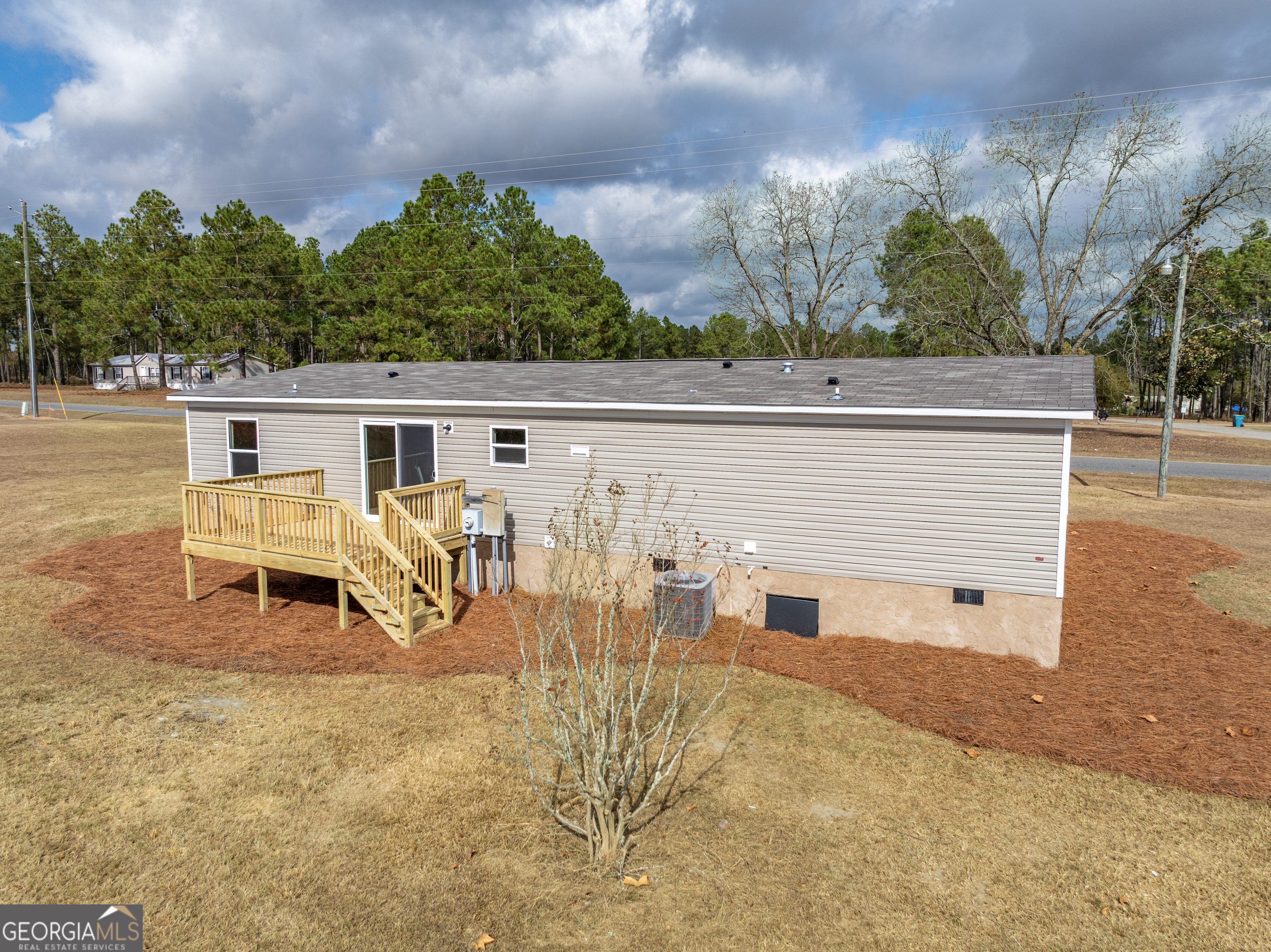102 Courtney Circle Sumner, GA 31789 - Photo 32 of 32 a view of a patio with a table and chairs