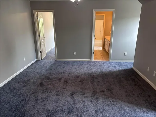 a view of room with window and bathroom