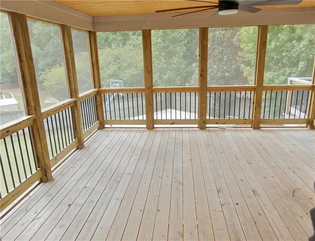 a view of porch with wooden floor