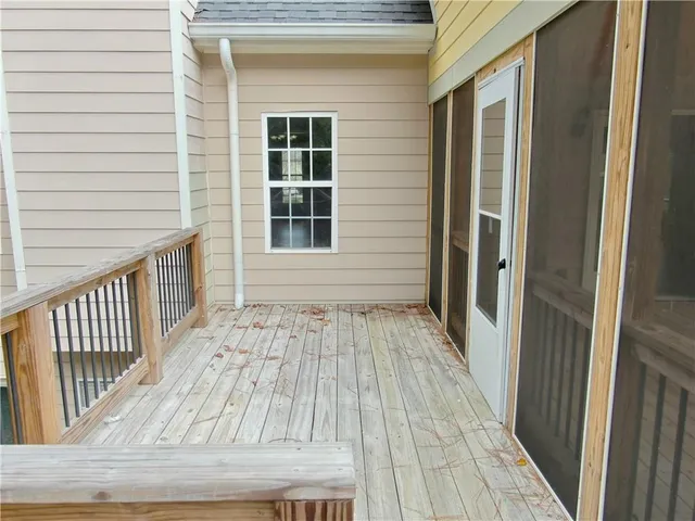 a view of a white house with a yard