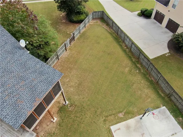 an aerial view of residential house with outdoor space