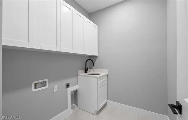 a bathroom with a sink and cabinets