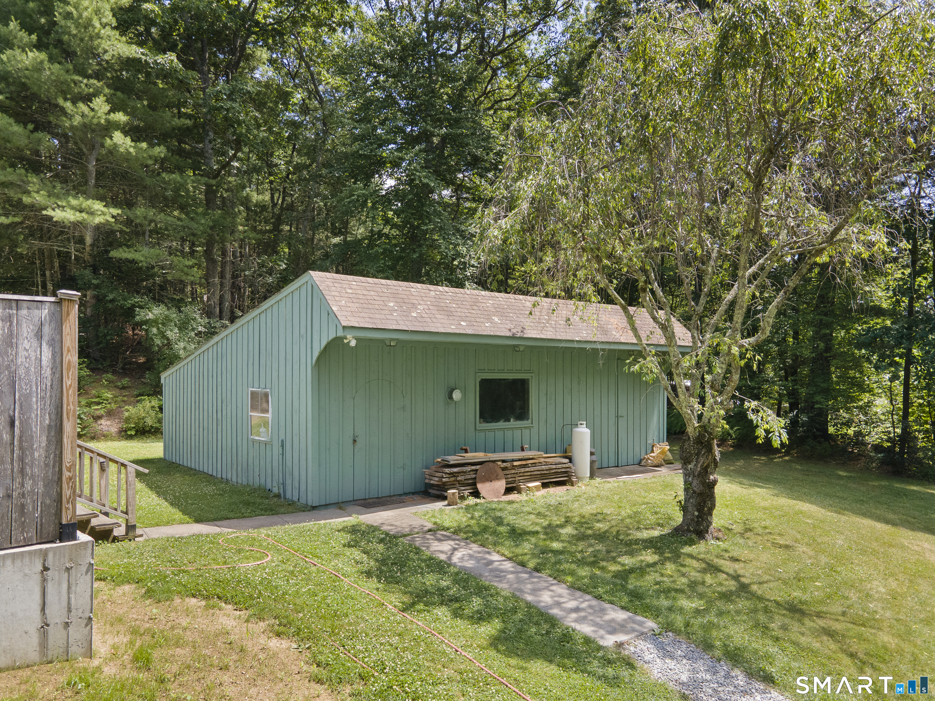11 Munyan Road Putnam, CT 06260 - Photo 24 of 33 a backyard of a house with barbeque oven