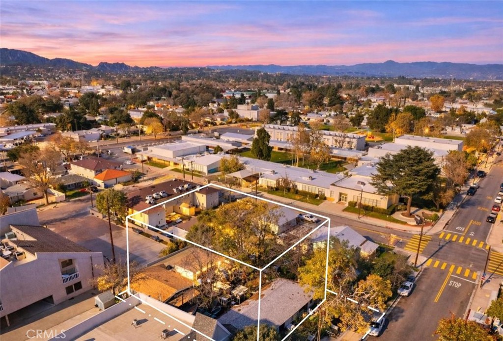 24513 Walnut Street Newhall, CA 91321 - Photo 4 of 11 an aerial view of residential houses with outdoor space