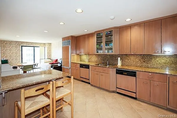 a kitchen with sink stove and cabinets