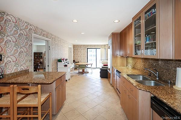 360 Shore Road, Unit 6L & 6M Long Beach, NY 11561 - Photo 19 of 33 a kitchen with sink stove and cabinets