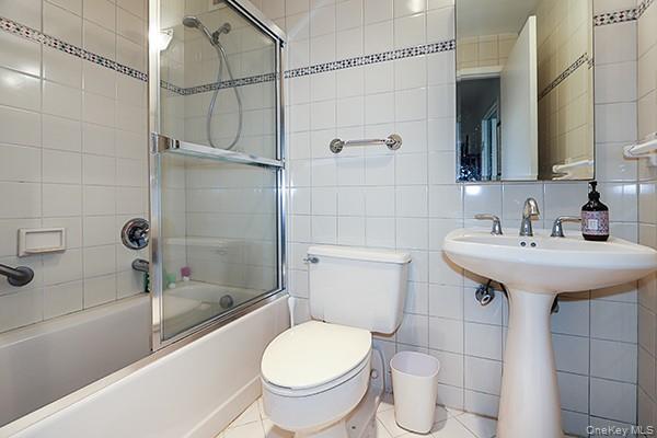 360 Shore Road, Unit 6L & 6M Long Beach, NY 11561 - Photo 23 of 33 a bathroom with a sink toilet and shower