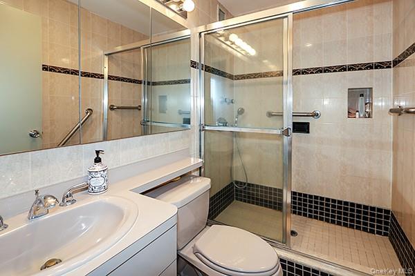 360 Shore Road, Unit 6L & 6M Long Beach, NY 11561 - Photo 25 of 33 a bathroom with a sink toilet and shower