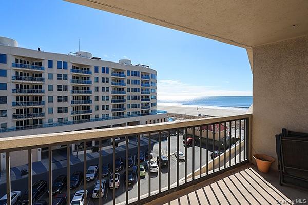 360 Shore Road, Unit 6L & 6M Long Beach, NY 11561 - Photo 26 of 33 a view of a balcony with a floor to ceiling window and wooden floor