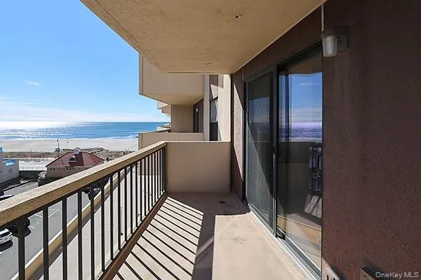 a view of a balcony with an ocean view