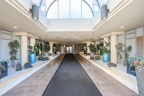 360 Shore Road, Unit 6L & 6M Long Beach, NY 11561 - Photo 3 of 33 a view of a lobby with potted plants
