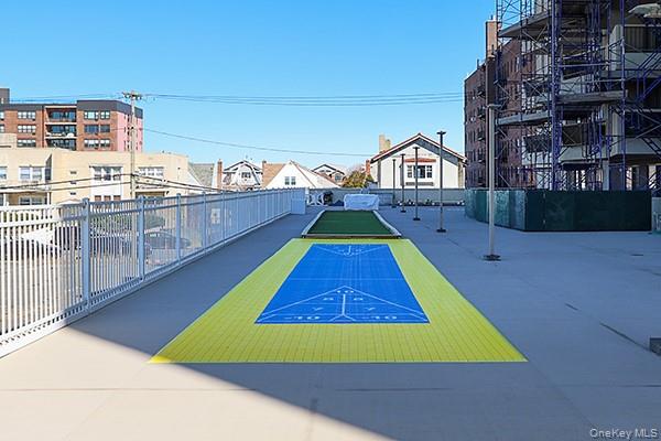 360 Shore Road, Unit 6L & 6M Long Beach, NY 11561 - Photo 32 of 33 a view of multiple houses with a swimming pool