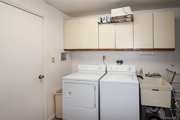 360 Shore Road, Unit 6L & 6M Long Beach, NY 11561 - Photo 7 of 33 a utility room with dryer and washer
