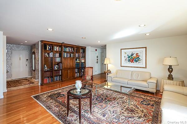 360 Shore Road, Unit 6L & 6M Long Beach, NY 11561 - Photo 10 of 33 a living room with furniture and wooden floor