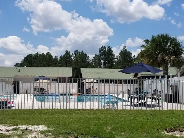 a view of a golf course with a house