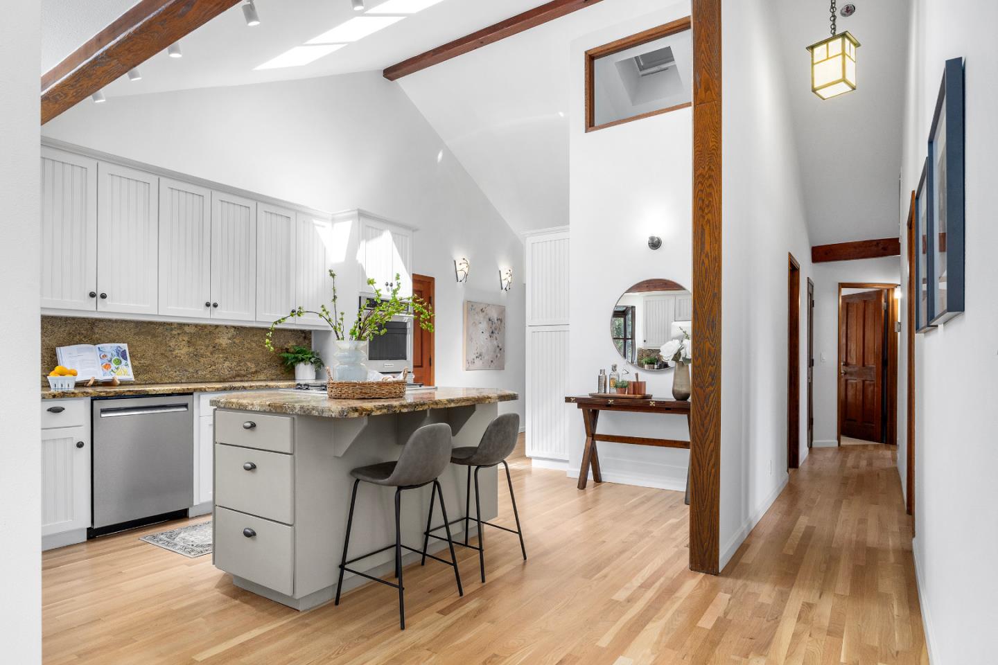 220 Hidden Valley Ridge Soquel, CA 95073 - Photo 12 of 66 a kitchen with white cabinets and wooden floor