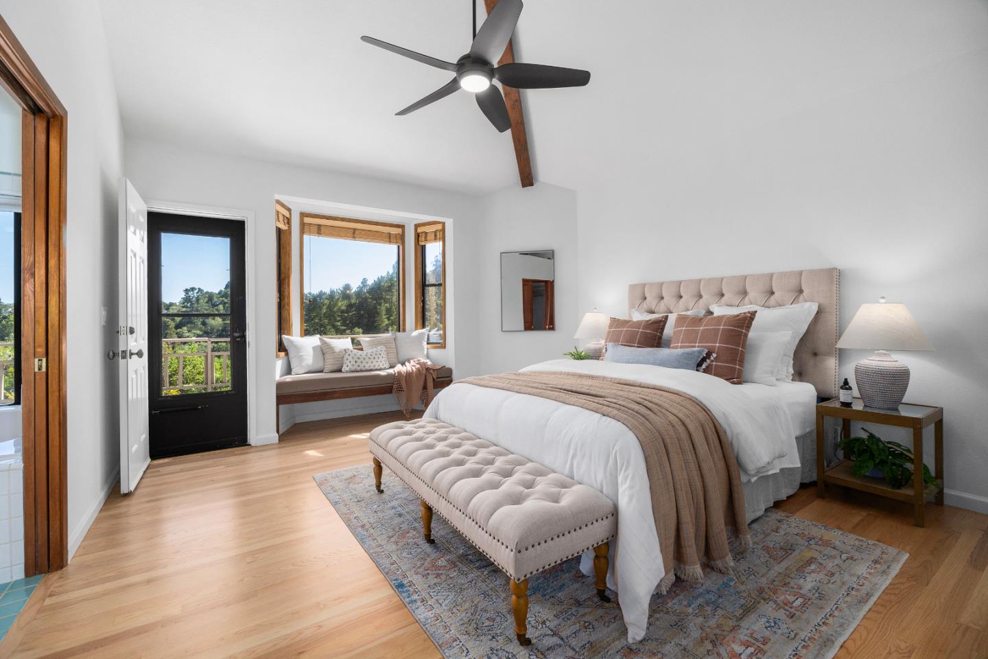 220 Hidden Valley Ridge Soquel, CA 95073 - Photo 19 of 66 a bedroom with a large bed couch and a window