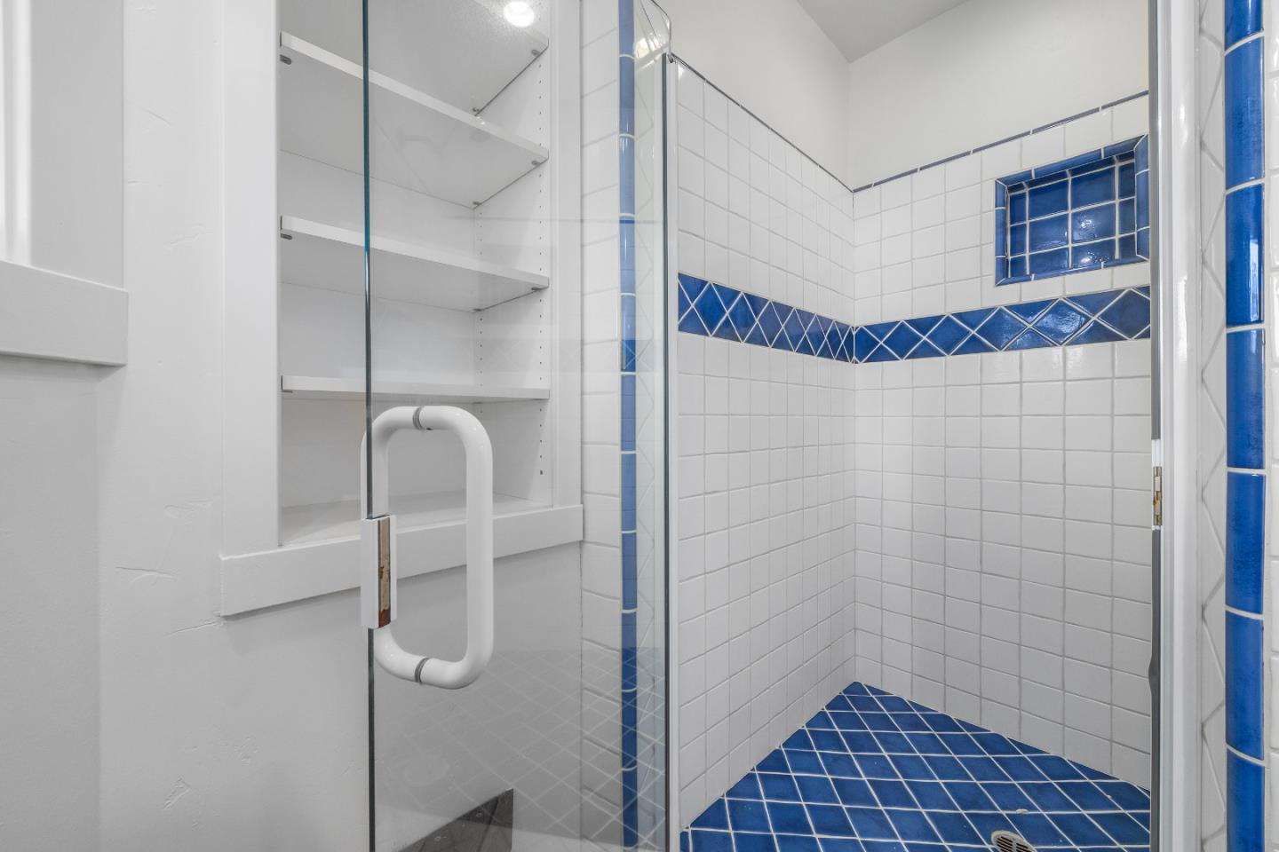 220 Hidden Valley Ridge Soquel, CA 95073 - Photo 38 of 66 a bathroom with a shower and a glass door