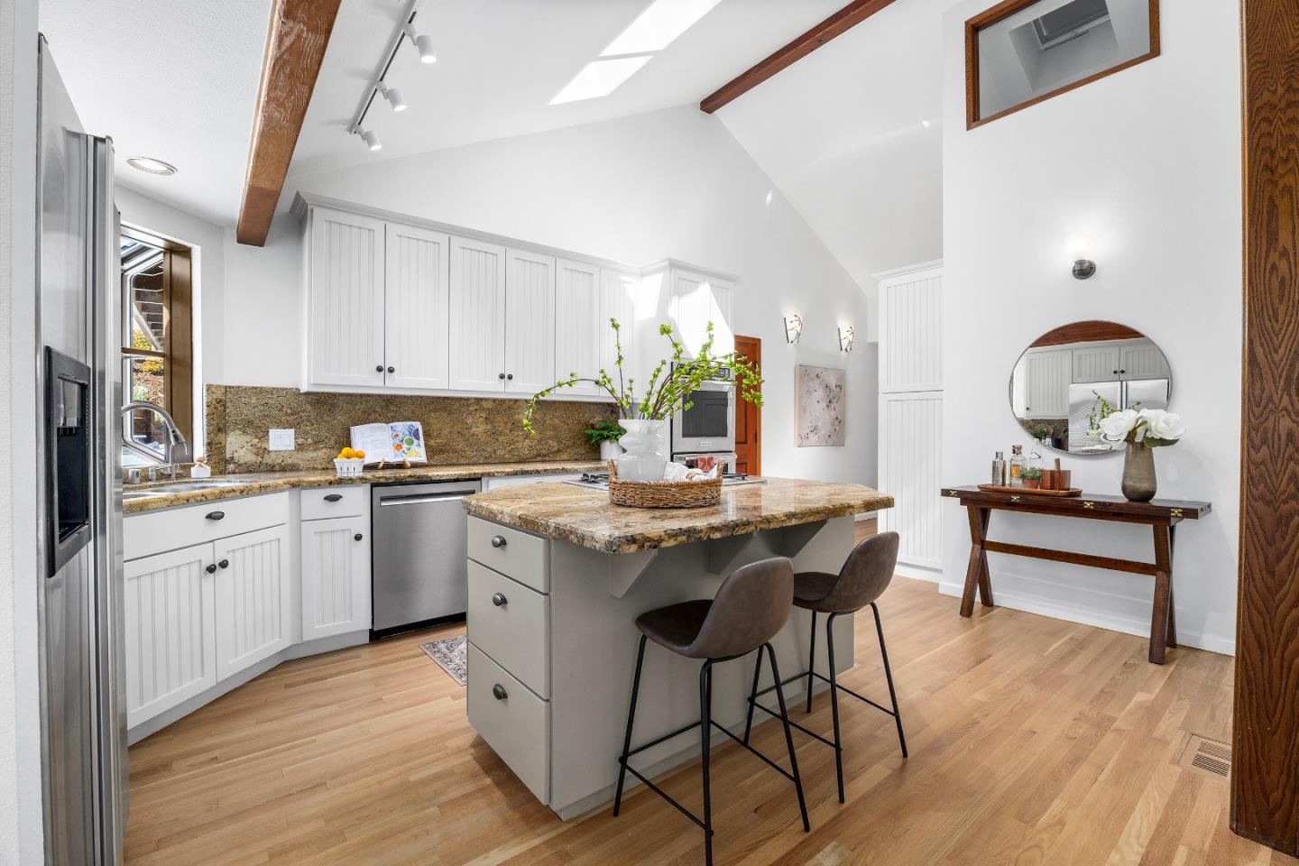 220 Hidden Valley Ridge Soquel, CA 95073 - Photo 9 of 66 a kitchen with granite countertop a table chairs stove and cabinets