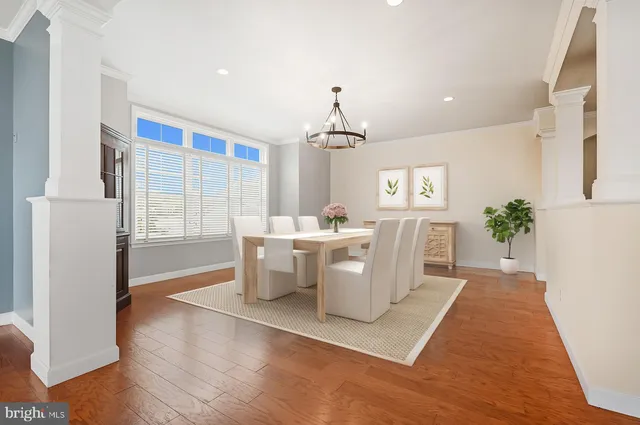 a view of a kitchen with a sink and a refrigerator