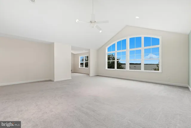 a bedroom with bed and window