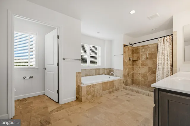 a work room with furniture and windows