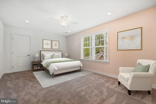 a bed room with a bed and a window