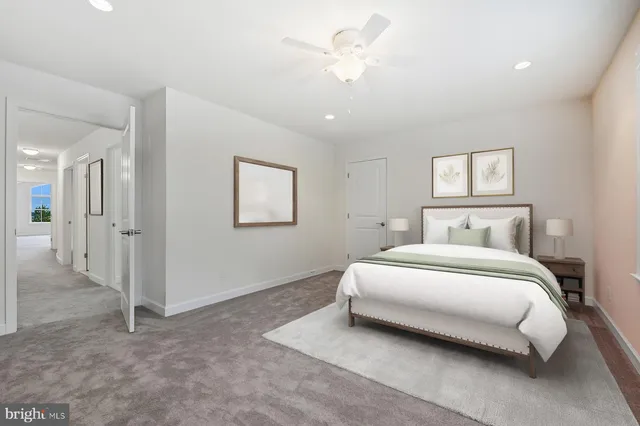 a bedroom with a bed and a couch