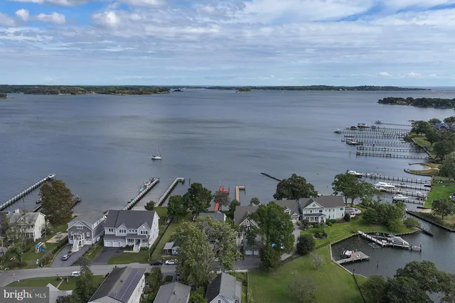 an aerial view of a houses with outdoor space