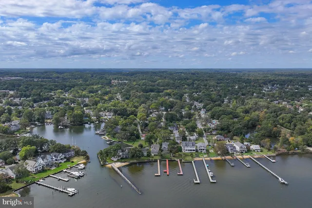 an aerial view of residential house with outdoor space and lake view