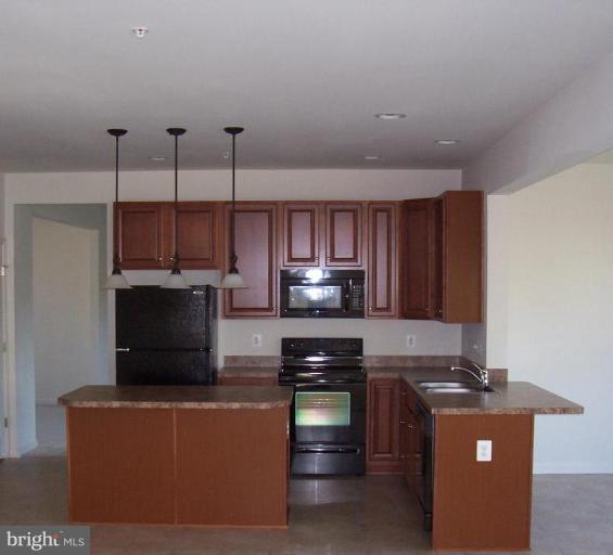1728 Canal Clipper Court Point of Rocks, MD 21777 - Photo 2 of 5 a kitchen with stainless steel appliances granite countertop a stove and a refrigerator