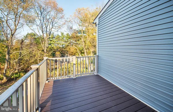 a view of balcony with wooden floor