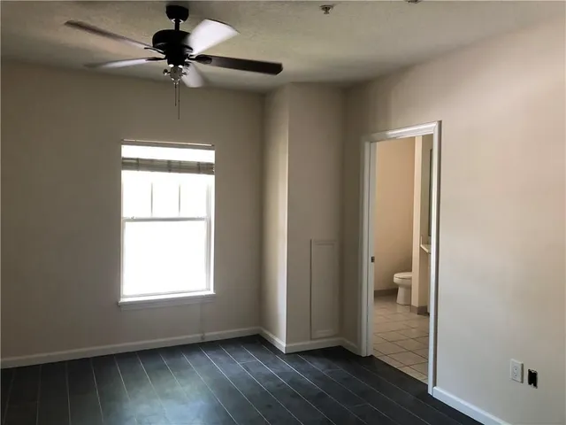 a view of an empty room and a window